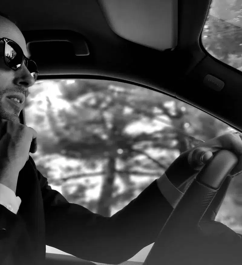 Chauffeur driving with focus, providing premium service in Biarritz