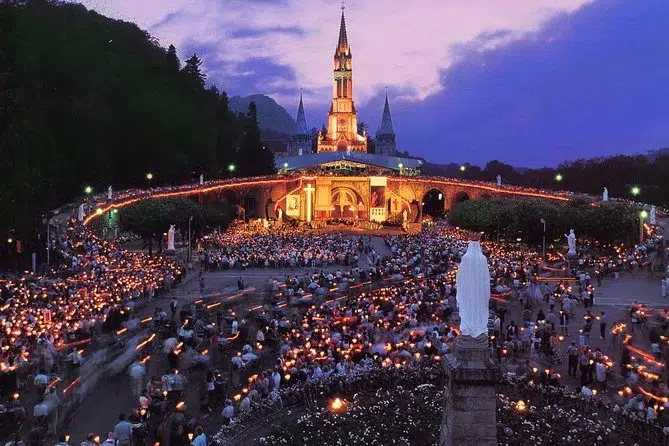 Night procession of pilgrims in Lourdes