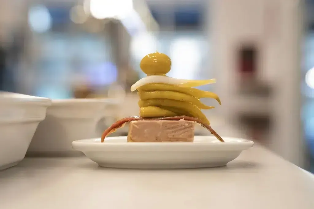 Delicious pintxos displayed on a plate in a San Sebastian bar