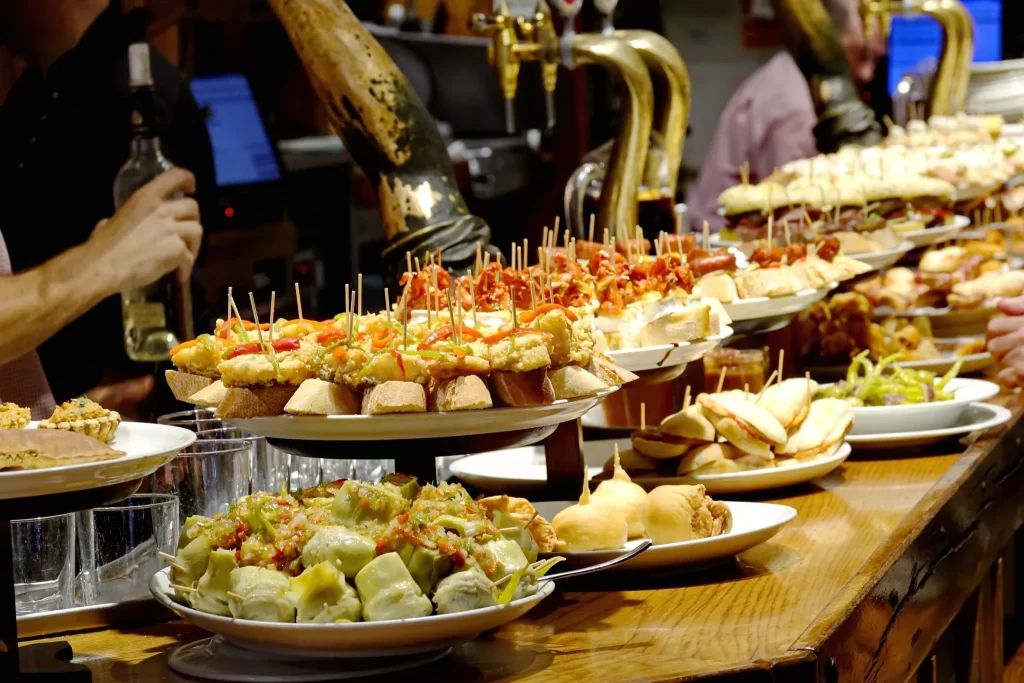 A colorful pintxos bar in San Sebastian with traditional Basque tapas.