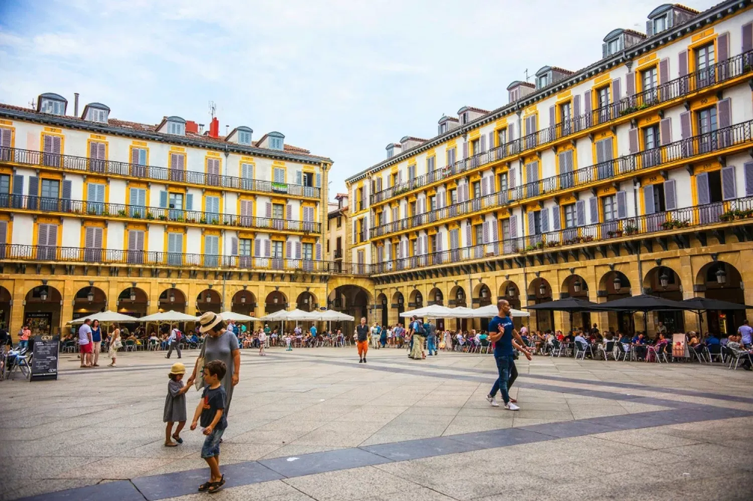 Plaza de la Constitución in San Sebastian with vibrant architecture.