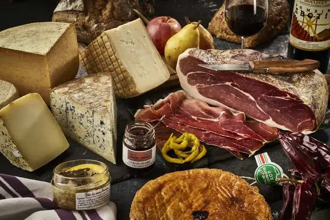 A delicious spread of Basque specialties, including cheese, ham, and wine at Le Comptoir Basque