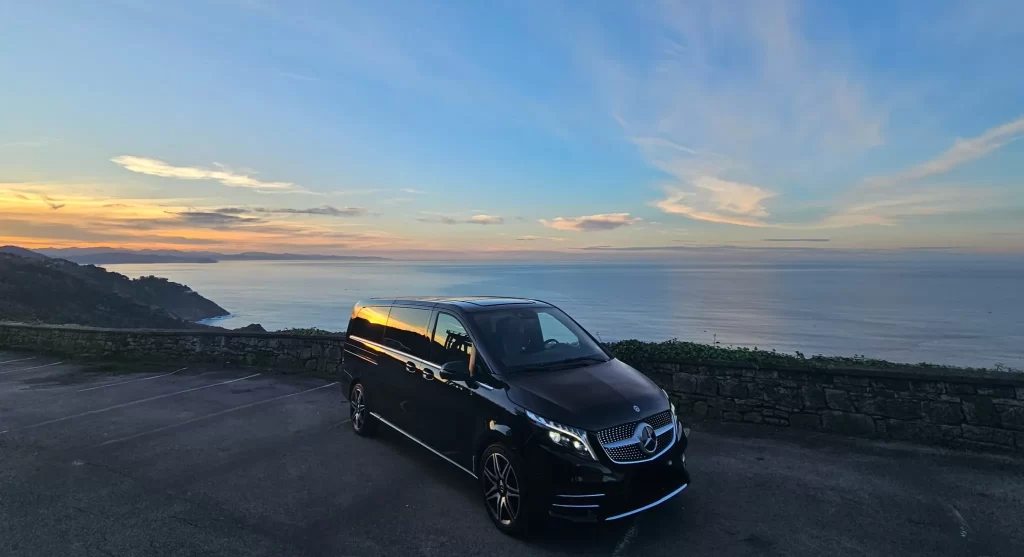 Minicab in Biarritz with a private chauffeur, luxury transport service overlooking the Basque coast at sunset
