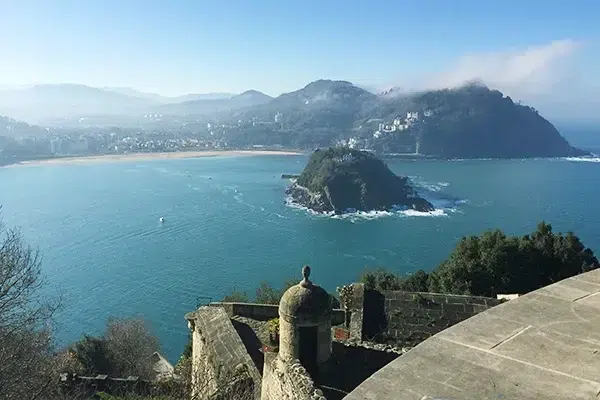 Panoramic view of San Sebastian with La Concha Bay and Monte Urgull, showcasing the city’s beauty and coastline