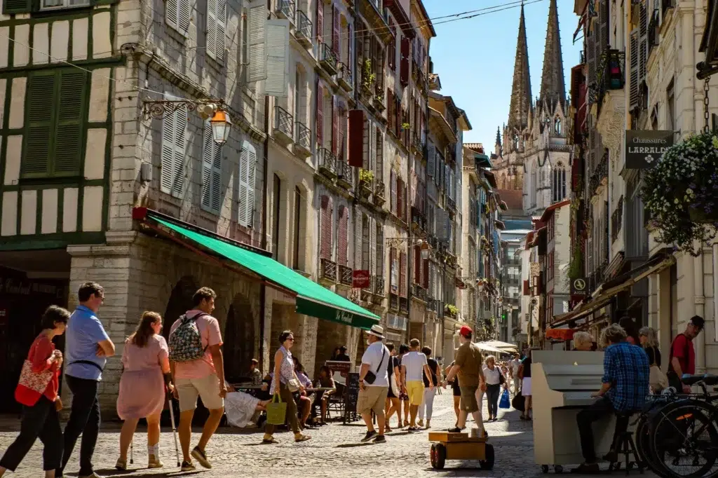 Historic street in central Bayonne with cathedral in the background