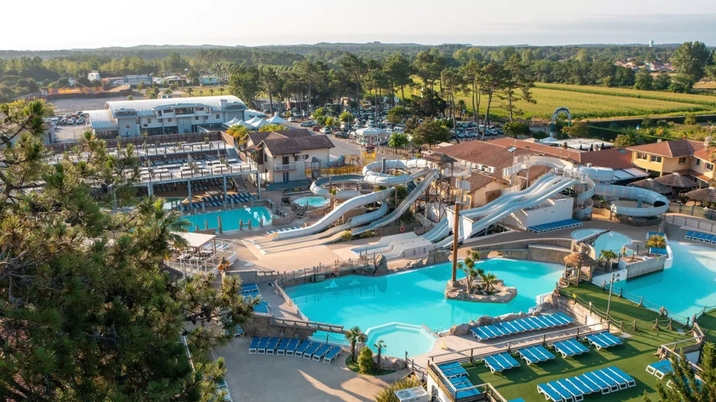 Aerial view of Camping Le Vieux Port Messanges with waterpark pine forest and Atlantic coast Biarritz airport transfer